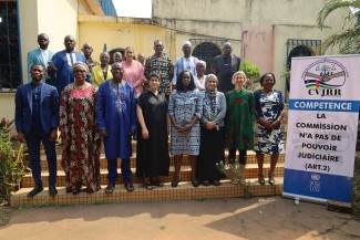 A group of people stand outside in Bangui, Central African Republic, for a group photo.